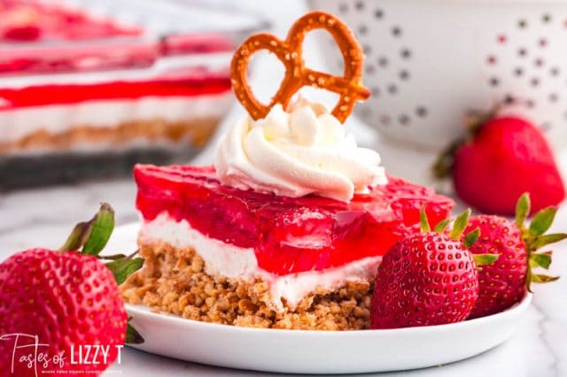 a piece of strawberry pretzel jello salad on a plate