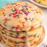 stack of funfetti pancakes with glaze and sprinkles