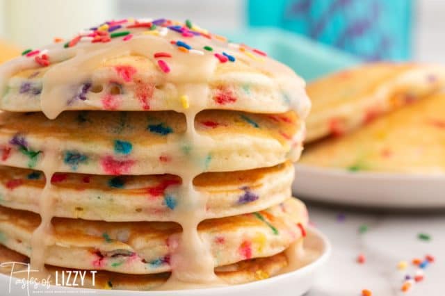 stack of funfetti pancakes with dripping glaze