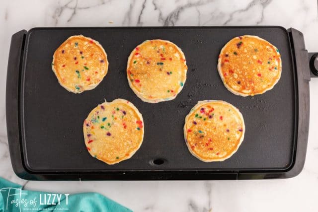 5 pancakes on a griddle