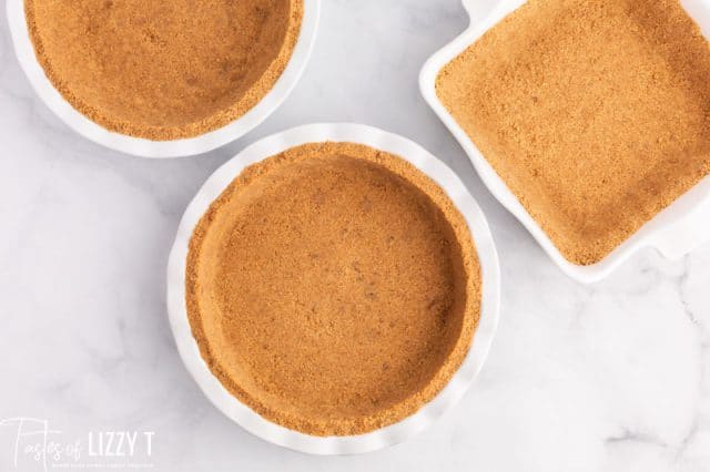 3 baking dishes with graham cracker crusts
