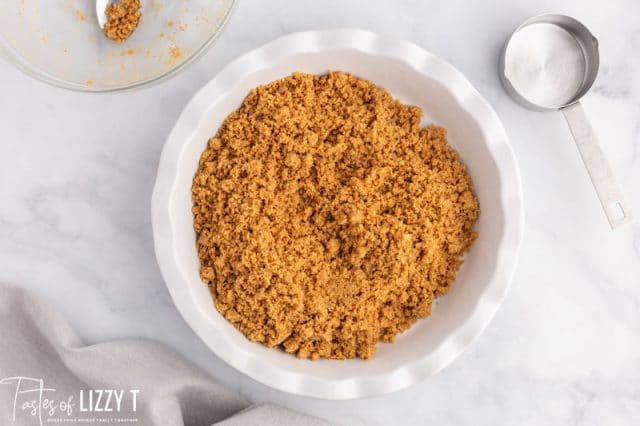 graham cracker crumbs in a pie plate