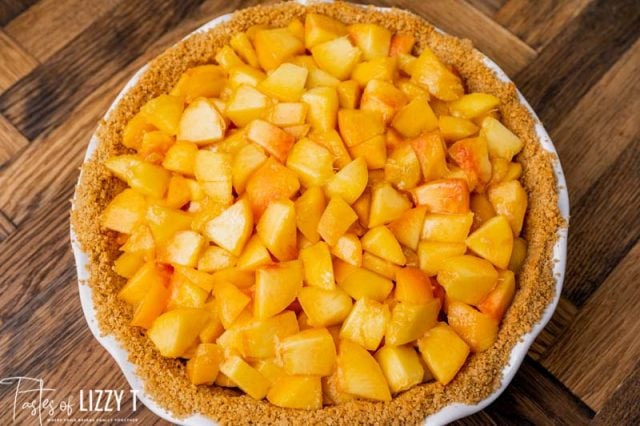 graham cracker crust filled with peaches