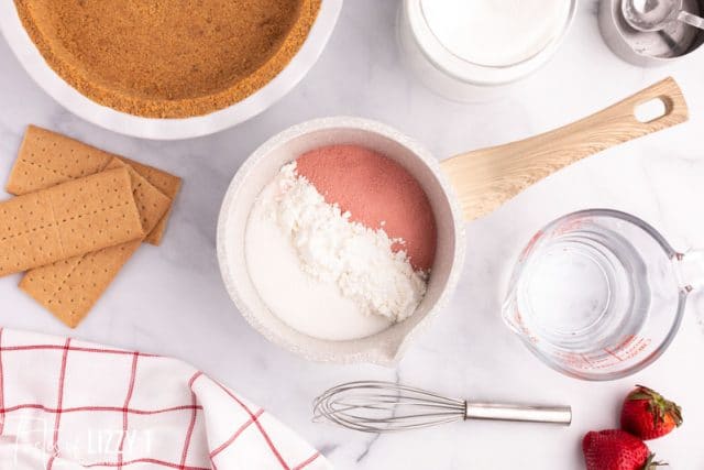 ingredients for strawberry pie on a table