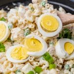 closeup of tuna macaroni salad on a serving spoon