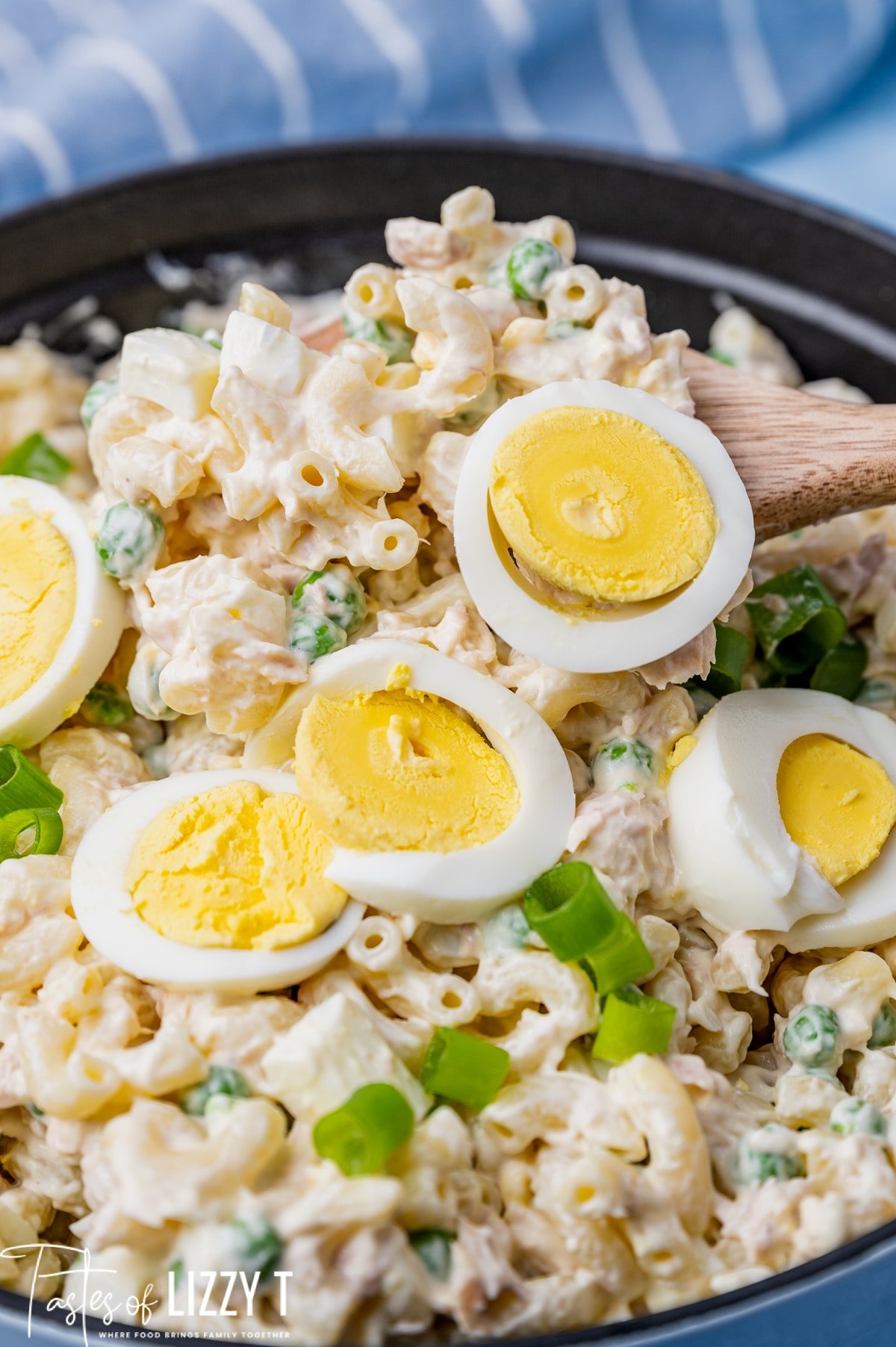 closeup of tuna macaroni salad on a serving spoon