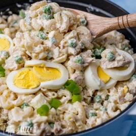 closeup of tuna macaroni salad on a serving spoon