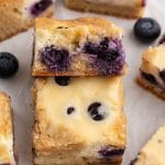 blueberry cheesecake blondies bars on a table