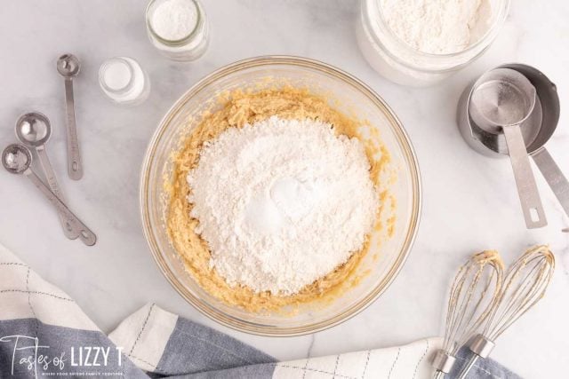 blondie batter in a bowl with flour on top