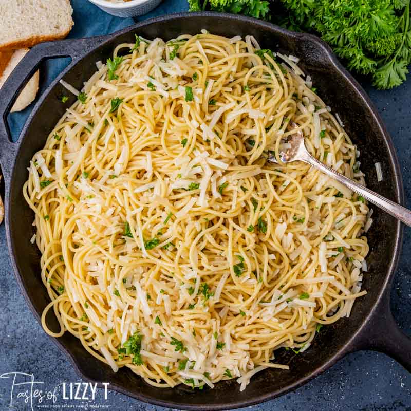 overhead view of spaghetti in a skillet with a fork