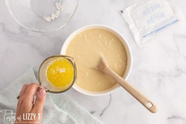 pouring butter into cake batter