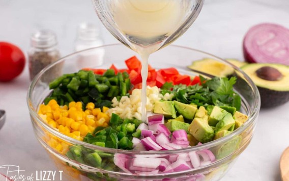 juice pouring over fresh vegetable salad