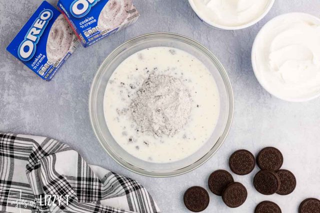 oreo pudding over milk in a bowl