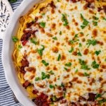 baked spaghetti pie with cheese and parsley