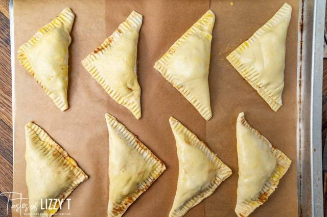 unbaked turnovers on a baking sheet