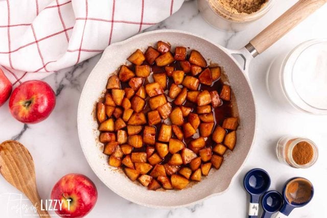 overhead view of skillet with cinnamon apples