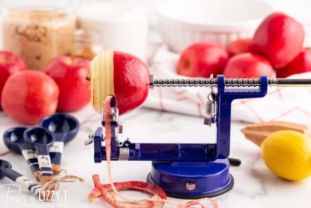 apple on an apple peeler tool