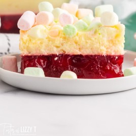 a slice of marshmallow jello salad on a plate