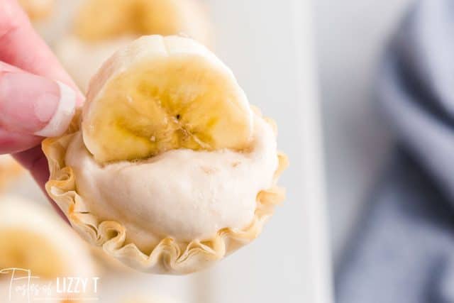 hand holding a banana cheesecake