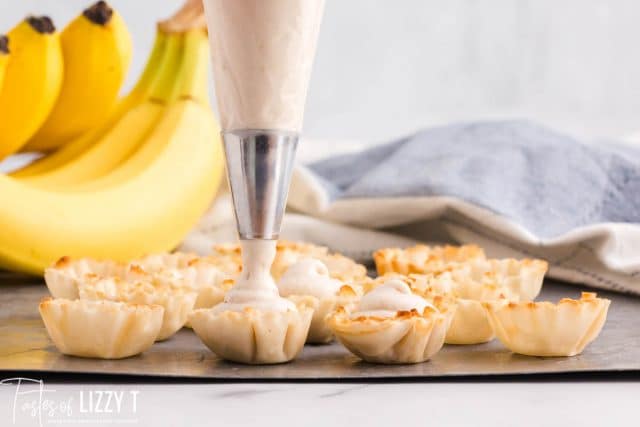 piping banana filling into a phyllo shell