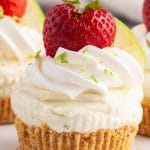 closeup of a lime cheesecake with strawberry on top