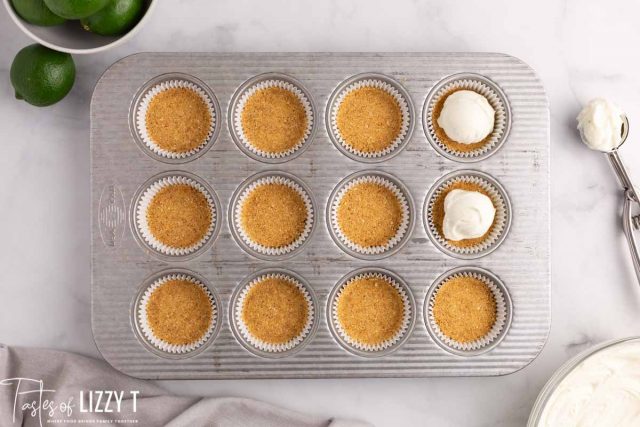 overhead view of no bake cheesecake filling in a cupcake tin