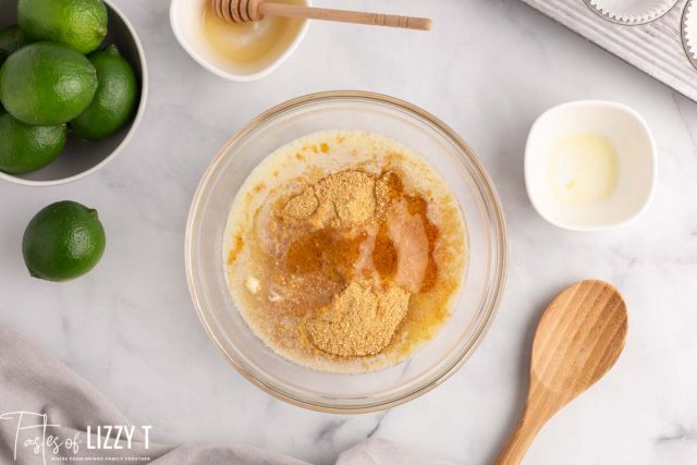 graham crackers and butter in a mixing bowl