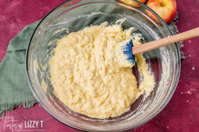 cornbread batter with apples in a bowl