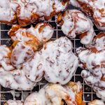 apple fritter donuts on a wire rack