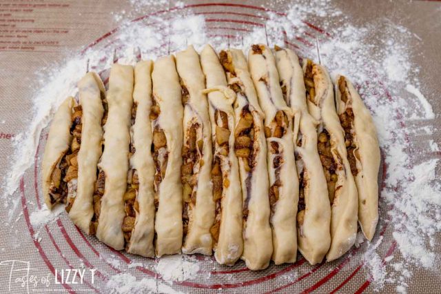 dough cut with fried apples inside