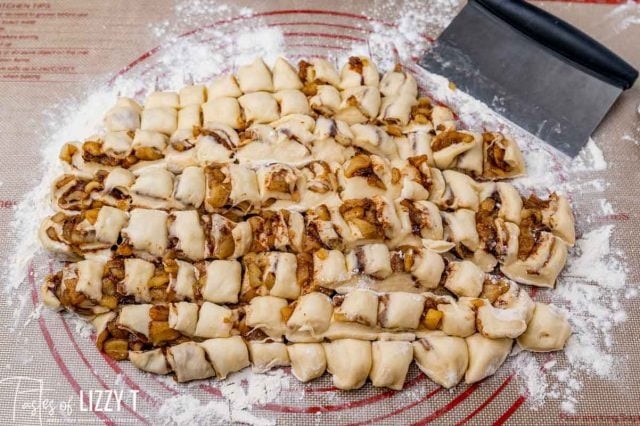 apple fritter dough on a pastry mat