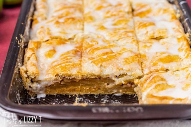 apple bars in a pan with two pieces missing