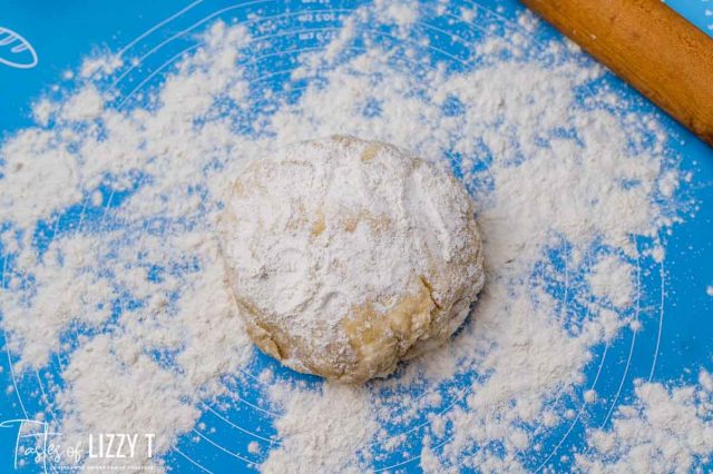 pie dough with flour on a pastry mat