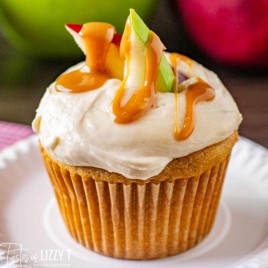 a cupcake with apples sitting on a plate