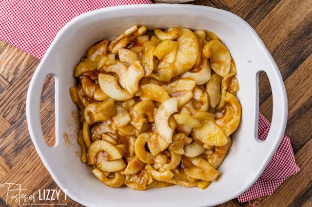 sliced cinnamon apples in an 8x8 pan