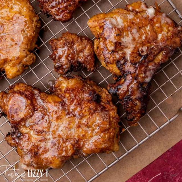 closeup of fried chicken on a wire rack