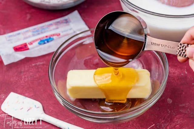 honey pouring over butter in a bowl