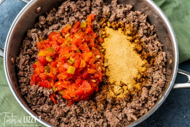 ground beef, seasoning and rotel in a bowl