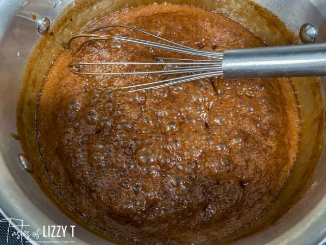 boiling chocolate syrup in a pan