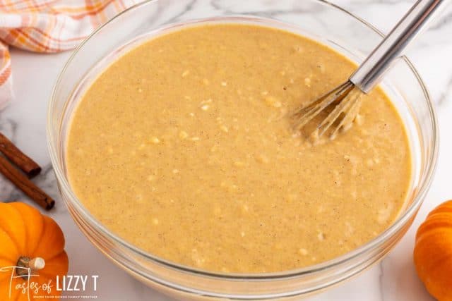 pancake batter in a bowl with a whisk