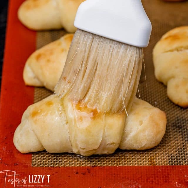 butter brushing on dinner rolls