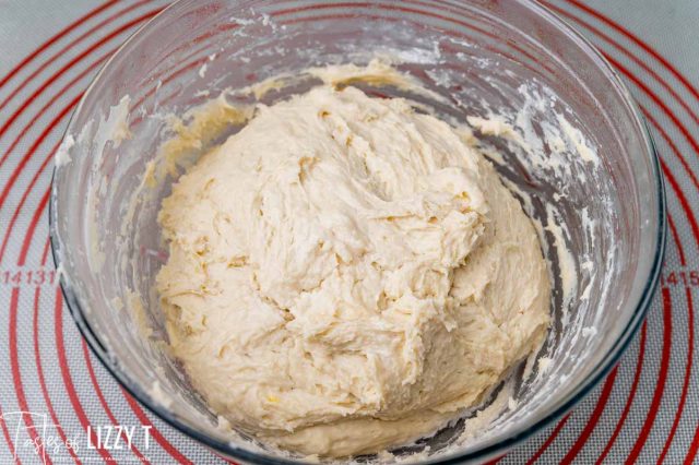 risen overnight dough in a bowl