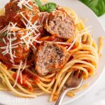 homemade italian meatballs over spaghetti