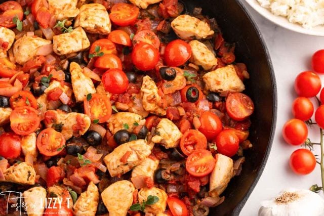 closeup of one skillet mediterranean chicken