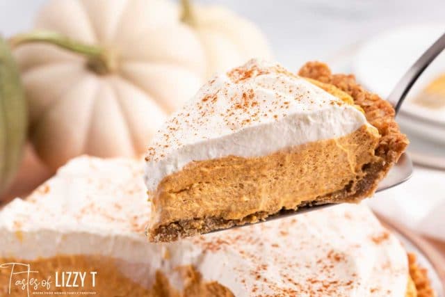 a spatula scooping out a piece of no bake pumpkin pie