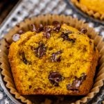 half of a chocolate chip pumpkin muffin in a pan