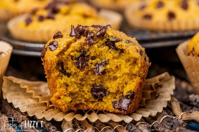 half of a chocolate chip pumpkin muffin on a table