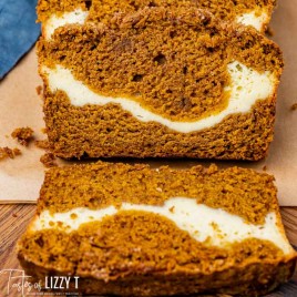 two slices of pumpkin cream cheese bread