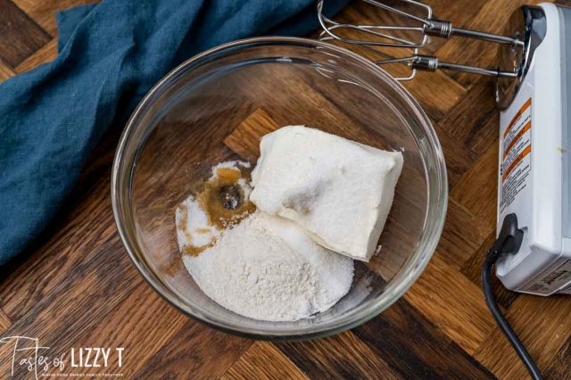 cream cheese, sugar and flour in a mixing bowl