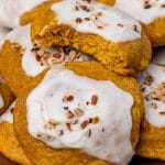 a plateful of soft pumpkin cookies with icing